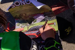 Kpax driver signs a Sonoma poster. SRO America, Sonoma Raceway, Sonoma, CA, April  2022.
 | RegisLefebure/SRO
